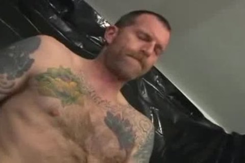 Two juicy Tattooed Leather Daddies